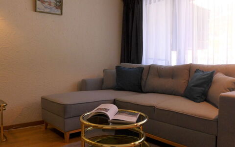 Milihaus a: Brown, Furniture, Property, Couch, Table, Comfort, Wood, Building, Curtain, Studio Couch