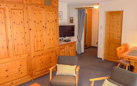 Oasis: Furniture, Cabinetry, Comfort, Building, Chair, Orange, Wood, Table, Architecture, Interior Design