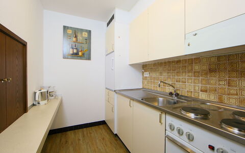 Leukerbad 900: Room, Property, Kitchen, Furniture, Floor, Yellow, Interior Design, Real Estate, Countertop, Building