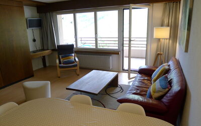 Ringstrasse Apt 121 900.25: Furniture, Table, Couch, Comfort, Curtain, Living Room, Chair, Wood, Building, Floor