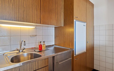 Crans-Montana 388: Kitchen, Countertop, Flooring, Wood, Kitchen Appliance, Interior Design, Kitchen Sink, Major Appliance, Cabinetry, Floor