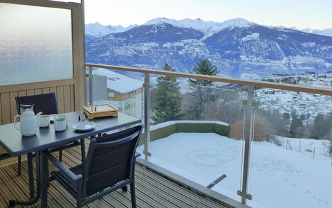 Crans-Montana 395: Sky, Table, Furniture, Property, Building, Mountain, Snow, Chair, Architecture, Shade