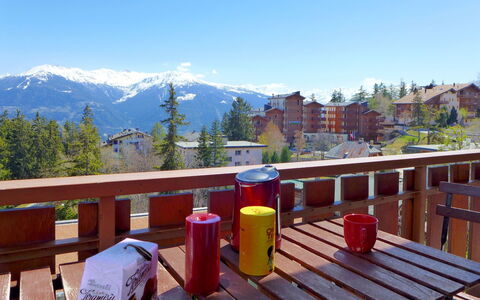 Crans-Montana 560: Sky, Property, Building, Mountain, Nature, Wood, Fence, Outdoor Furniture, Tree, Table