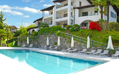 Piazzogna 100: Water, Plant, Building, Property, Sky, Swimming Pool, Cloud, Window, Azure, Tree