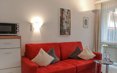 Residenza Lido Appartment 009 410.2: Picture Frame, Couch, Furniture, Property, Comfort, Living Room, Wood, Lighting, Flooring, Floor