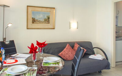 Residenza Lido Appartment 008 410.1: Building, Table, Couch, Furniture, Property, Tableware, Picture Frame, Comfort, Living Room, Interior Design