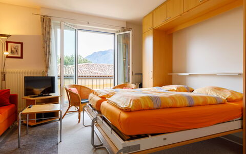 Ascona 100: Furniture, Property, Comfort, Building, Orange, Interior Design, Wood, Bed Frame, Lamp, Pillow
