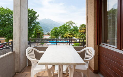 Breganzona 100: Table, Furniture, Sky, Property, Building, Cloud, Chair, Wood, Window, Porch