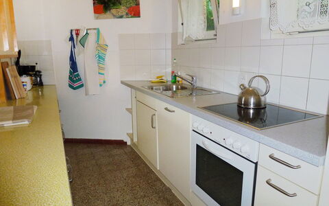 Carlo Cityview Lugano: Room, Property, Countertop, Kitchen, Furniture, Floor, Interior Design, Yellow, Sink, House