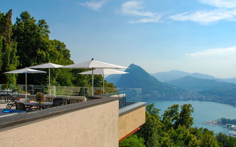 Aldesago 102: Water, Sky, Cloud, Tree, Building, Seaside Resort, Coastal And Oceanic Landforms, Outdoor Furniture, Shade, Umbrella