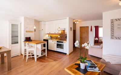 Chesa Piz Cotschen 3 170.3: Table, Furniture, Wood, Orange, Flooring, Floor, Building, Living Room, Plant, Shelving