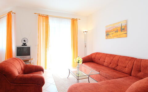Balatonmariafurdo 750: Furniture, Room, Property, Orange, Interior Design, Living Room, Couch, Comfort, Yellow, Building