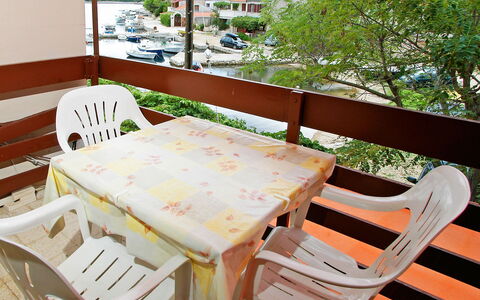 Korčula Vela Luka 800: Chair, Furniture, Table, Room, Dining Room, Tree, Tablecloth, Porch, House, Textile