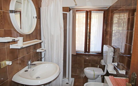 Tignale 150: Bathroom, Room, Property, Plumbing Fixture, Interior Design, Wall, Bathroom Cabinet, Toilet, Bathroom Sink, Bathroom Accessory