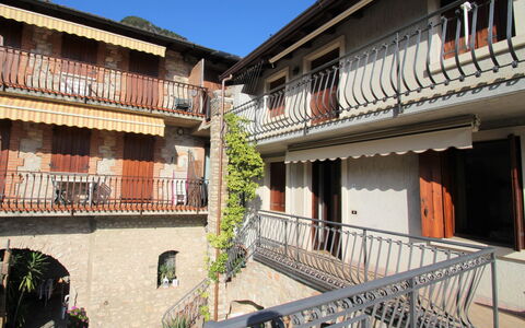 Tignale 150: Building, Sky, Plant, Property, Window, House, Urban Design, Wood, Residential Area, Real Estate