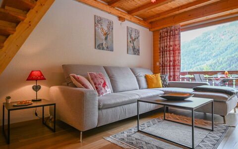 Ovronnaz 700: Furniture, Table, Property, Couch, Picture Frame, Window, Interior Design, Wood, Lighting, Orange