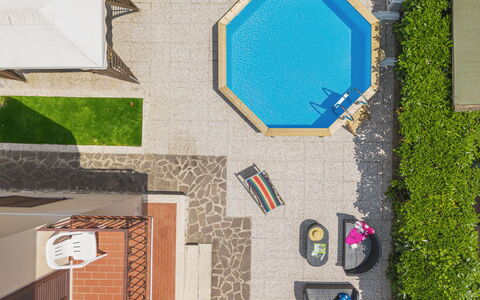 Antonia: Property, Azure, Textile, Wood, Rectangle, Art, Urban Design, Flooring, Line, Grass