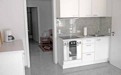 Willmann: Room, Property, Kitchen, Furniture, Floor, Building, Major Appliance, House, Tile, Cabinetry