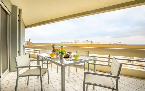 Canet-Plage 310: Furniture, Sky, Table, Building, Flower, Cloud, Plant, Wood, Shade, Chair