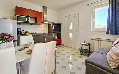 Aquanur 100.3: Furniture, Flooring, Floor, Interior Design, Apartment, Room, Chair, Ceiling, Kitchen, Countertop