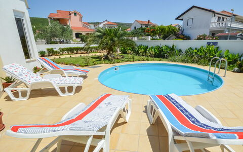 Valdor: Sky, Building, Property, Water, Plant, Azure, Swimming Pool, Outdoor Furniture, Tree, Shade