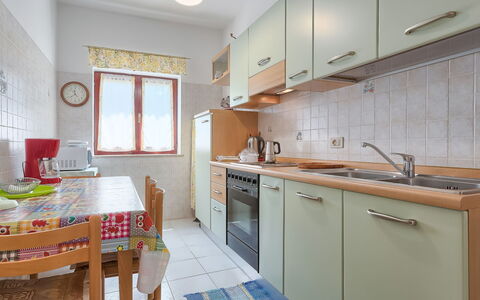 Licia: Furniture, Cabinetry, Sink, Countertop, Kitchen Sink, Table, Kitchen, Tap, Chair, Window