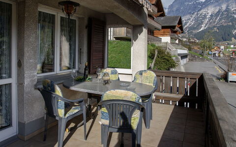 Grindelwald 104: Furniture, Home, Chair, Outdoor Furniture, Balcony, Porch, Shade, Houseplant, Outdoor Table, Kitchen & Dining Room Table
