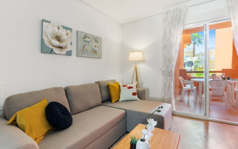 Las Calitas Bloque Iii: Table, Couch, Furniture, Property, Comfort, Picture Frame, Living Room, Interior Design, Orange, Studio Couch