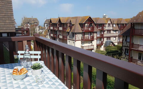 Deauville-Trouville 140: Sky, Building, Cloud, Table, Tableware, Wood, Chair, House, Urban Design, Window