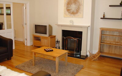 Kenmare 700: Brown, Property, Furniture, Table, Wood, Couch, Hearth, Interior Design, Comfort, Picture Frame