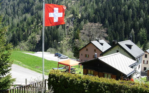Verena: Flag, House, Home, Hill Station, Signage, Mountain Range, Tree, Rural Area, Grass, Sign