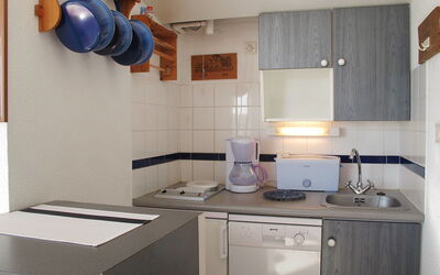 Grand Pavois 730.3: Room, Property, Furniture, Cabinetry, Kitchen, Countertop, Purple, House, Tile, Building