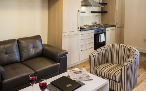Dublin 200: Table, Couch, Furniture, Property, Comfort, Lighting, Interior Design, Studio Couch, Flooring, Wood