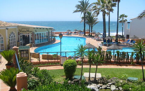Dona Lola: Water, Plant, Sky, Property, Swimming Pool, Seaside Resort, Azure, Tree, Building, Outdoor Furniture