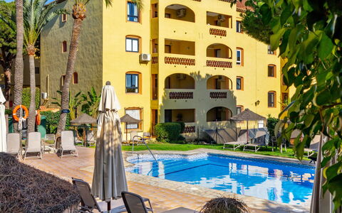 Dona Lola: Water, Building, Plant, Property, Azure, Swimming Pool, Window, Tree, Lighting, Architecture