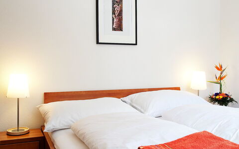 Leukerbad 190: Bed, Bedroom, Furniture, Room, Property, Bed Sheet, Bed Frame, Orange, Bedding, Interior Design
