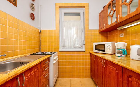 Grand Jardin: Cabinetry, Countertop, Property, Kitchen Sink, Sink, Kitchen, Wood, Orange, Lighting, Interior Design