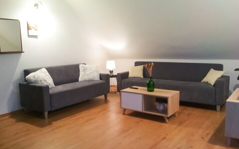 Grand Jardin: Brown, Couch, Table, Property, Furniture, Comfort, Architecture, Studio Couch, Wood, Interior Design