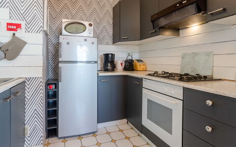 Le Normandie Home: Cabinetry, Property, Furniture, Countertop, Building, Kitchen Appliance, Kitchen Stove, Kitchen, Interior Design, Home Appliance