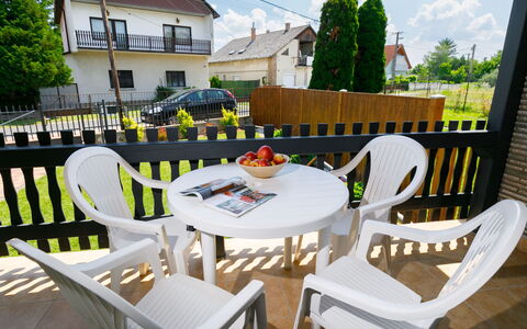 Hibiscus: Table, Furniture, Chair, Sky, Building, Outdoor Table, Tree, Cloud, Outdoor Furniture, Plant