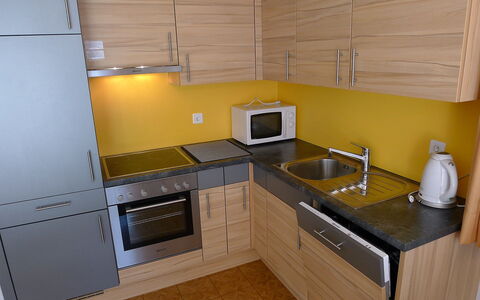 Amara: Countertop, Kitchen, Room, Cabinetry, Property, Kitchen Stove, Furniture, Major Appliance, Yellow, Floor