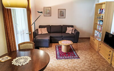 Leukerbad 550: Table, Furniture, Property, Couch, Picture Frame, Cabinetry, Interior Design, Comfort, Wood, Building