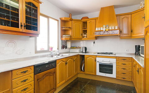 Salto del Monte: Countertop, Cabinetry, Kitchen, Room, Yellow, Furniture, Property, Building, Orange, Interior Design