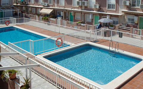 Tamarit Beach: Water, Building, Property, Window, Swimming Pool, Plant, Azure, Flowerpot, Architecture, Houseplant