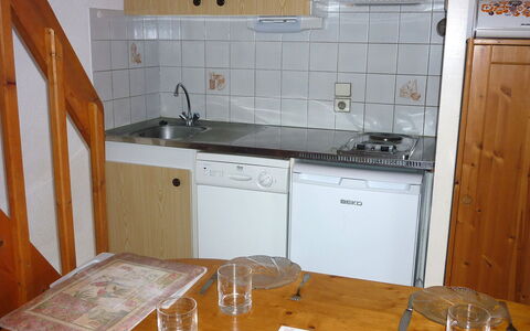 Capbreton 606: Room, Countertop, Kitchen, Property, Cabinetry, Furniture, Tile, Kitchen Stove, Floor, Building