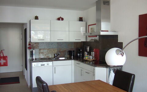 Promenade Wohnung 21: Room, Property, Furniture, Floor, Countertop, Kitchen, Interior Design, Building, House, Cabinetry
