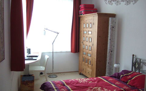 Promenade Wohnung 21: Room, Bedroom, Furniture, Property, Red, Bed, Curtain, Interior Design, Pink, Bed Sheet