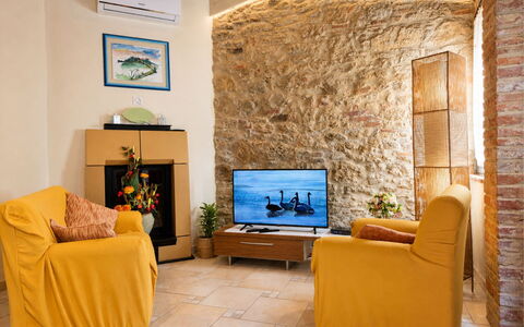 Pieve di Sant Ippolito: Furniture, Interior Design, Wall, Flooring, Wood, Floor, Room, Lighting, Living Room, Couch