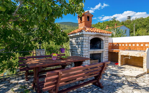 Kristijana: Sky, Outdoor Bench, Building, Cloud, Plant, Wood, Tree, Outdoor Furniture, Natural Landscape, Brick