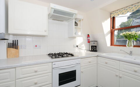 Looe 107: White, Property, Room, Countertop, Kitchen, Cabinetry, Furniture, Interior Design, Building, House